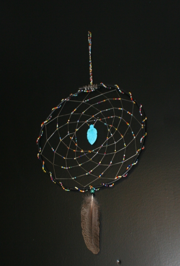 many seasons dreamcatcher by john pete with colorful beads and turquoise feather 